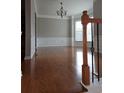 Spacious living room with hardwood floors, detailed trim, and bright windows at 6121 Joybrook Rd, Johns Creek, GA 30097