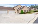Lovely home exterior boasting an attached garage and well-maintained landscaping at 202 Accord Sw Ln, Grayson, GA 30017