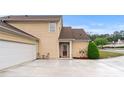 View of the house featuring a two-car garage and welcoming entrance at 202 Accord Sw Ln, Grayson, GA 30017