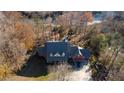 Aerial view of home nestled in wooded area near the river at 3212 Woodhaven Sw Ct, Conyers, GA 30094