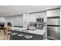 Modern kitchen featuring stainless steel appliances, white cabinets, and an island with bar seating at 3407 Spring Harbour Dr # 2, Doraville, GA 30340