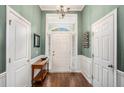Welcoming foyer with hardwood floors, neutral paint, and ample natural light at 352 Southgate Dr, Locust Grove, GA 30248