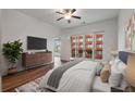 Spacious main bedroom with balcony, hardwood floors, ceiling fan, ensuite bathroom, and modern finishes at 384 Ralph Mcgill Ne Blvd # 318, Atlanta, GA 30312