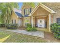 Inviting entrance with brick accents, 'WELCOME' sign, and decorative door creating a warm first impression at 595 Mcgarity Dr, Mcdonough, GA 30252