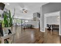Spacious living area featuring hardwood floors, ceiling fans, and large windows for natural light at 2582 Oak Bluff Dr, Dacula, GA 30019