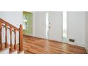Bright foyer with hardwood floors, staircase, and natural light at 1508 Walker Ridge Sw Dr, Marietta, GA 30064