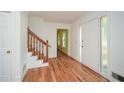 Bright foyer with hardwood floors, staircase, and a glass-lined front door at 1508 Walker Ridge Sw Dr, Marietta, GA 30064