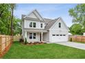 Charming two-story home with a well-manicured lawn and a two car garage at 1701 Aircraft S Dr, Marietta, GA 30060