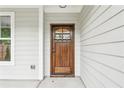 Stunning wood front door with decorative glass and sidelight at 1701 Aircraft S Dr, Marietta, GA 30060
