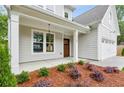 Inviting front porch with craftsman columns and lush landscaping at 1701 Aircraft S Dr, Marietta, GA 30060