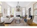 Bright living room featuring fireplace, neutral decor, hardwood floors, and ample natural light at 132 Mount Vernon Dr, Decatur, GA 30030