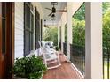 Relaxing front porch featuring rocking chairs, wood floors, and great natural light at 132 Mount Vernon Dr, Decatur, GA 30030