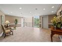Spacious building lobby area with tile flooring, seating, elevator and an abundance of natural light at 28305 Plantation Ne Dr, Atlanta, GA 30324