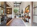 Grand foyer with high ceilings, detailed trim, staircase and view into other rooms with wood and tile floors at 31 Brownson Ct, Acworth, GA 30101