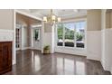 Dining room boasts hardwood floors, wainscoting, coffered ceilings, and lots of natural light at 3909 Obryant Se Cir, Smyrna, GA 30082