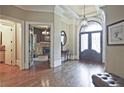 Welcoming foyer with hardwood floors, decorative mirror, and a view to the study at 5118 Greythorne Ln, Marietta, GA 30068