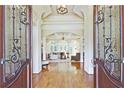 Grand foyer with hardwood floors, detailed trim, and an open view to the living room at 5118 Greythorne Ln, Marietta, GA 30068