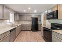 Kitchen featuring granite counters and black appliances at 6255 Saddlewood Dr, Lithonia, GA 30058