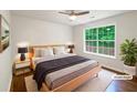 Well-lit bedroom features a large window and hardwood floors at 541 Mckenzie Ave, Stockbridge, GA 30281