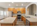 Well-equipped kitchen featuring stainless steel appliances, an island and beautiful countertops at 6053 Park Close, Fairburn, GA 30213