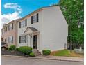 This is a two-story home with white siding, black shutters, and tidy landscaping at 285 Enterprise Path, Hiram, GA 30141