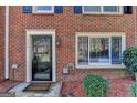 Welcoming front door of brick home, featuring a secure glass door at 6118 Queen Anne Ct, Norcross, GA 30093