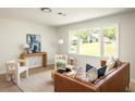 Well-lit living room with sleek furniture, modern decor, and a large window view at 2834 Vicksburg Ct, Decatur, GA 30034