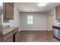 Spacious kitchen offers stainless steel appliances, ample countertop space, and bright natural light at 5326 Rocky Pine Dr, Lithonia, GA 30038