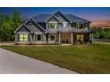 Charming two-story home with meticulously kept lawn and inviting front porch at 415 Paynes Lake Rd, Carrollton, GA 30116