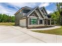 Stylish two-story home with a convenient attached garage and beautifully landscaped front yard at 415 Paynes Lake Rd, Carrollton, GA 30116