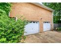 Spacious two-car garage featuring classic white doors and secure entrance at 2675 Kellogg Creek Rd, Acworth, GA 30102