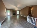Open living room with new flooring, fireplace, and lots of light at 2971 Cedar Mill Xing, Acworth, GA 30102