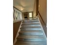 Stairway leads to an open living room with fireplace and window at 2971 Cedar Mill Xing, Acworth, GA 30102