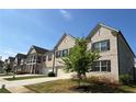 Charming two-story home with brick facade and landscaped front yard at 4029 Red Canoe Bnd, Lilburn, GA 30047