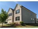 Charming home with brick and siding, surrounded by lush landscaping at 4029 Red Canoe Bnd, Lilburn, GA 30047