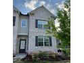 Lovely home with brick and gray siding, landscaped garden, and a welcoming entrance at 4029 Red Canoe Bnd, Lilburn, GA 30047