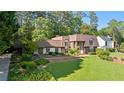 Beautiful home featuring well-manicured lawn and mature trees at 1178 Roxboro Ne Cv, Atlanta, GA 30324