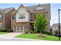 Attractive two-story brick home featuring a manicured lawn, two-car garage, and classic design elements at 2251 Nancy Creek Dr, Atlanta, GA 30341