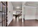 Elegant foyer showcasing hardwood floors, crown molding, and an open layout leading to the living spaces at 2251 Nancy Creek Dr, Atlanta, GA 30341
