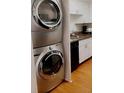 Laundry area featuring a new stackable washer and dryer and granite countertops at 2479 Peachtree Rd # 503, Atlanta, GA 30305