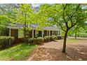 Charming home exterior, featuring a well-maintained lawn and lush greenery, offering a serene curb appeal at 681 Hampton Sw Pl, Marietta, GA 30064