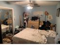 Bedroom with a closet and dresser, currently cluttered at 3683 Miller St, Lithia Springs, GA 30122