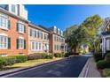 Street view of brick townhomes, manicured green spaces, and inviting community atmosphere at 4656 Ivygate Se Cir, Atlanta, GA 30339