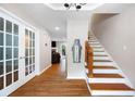 Welcoming foyer with hardwood floors and staircase at 5531 Hurstcliffe Nw Dr, Kennesaw, GA 30152