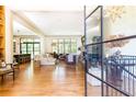 Sun-filled living room with hardwood floors, neutral décor, and open flow to the kitchen at 4785 Brinkley Ln, Atlanta, GA 30342