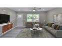 Bright living room with large windows, hardwood floors, and modern decor at 1660 Mallard Cir, Conley, GA 30288