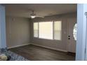 Bright living room featuring a window with blinds and luxury vinyl plank flooring at 257 E Simon Nw Ter, Atlanta, GA 30318