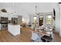 Inviting open-concept living space with island seating and a view to the fireplace and living room at 275 Crowe Springs Nw Rd, Cartersville, GA 30121