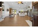 Open-concept living space with wood floors, stainless appliances, and dining area with lots of natural light at 275 Crowe Springs Nw Rd, Cartersville, GA 30121
