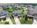 Beautiful neighborhood showcasing the home's placement on a spacious lot with lush landscaping and mature trees at 4280 Castlewood Rd, Cumming, GA 30040